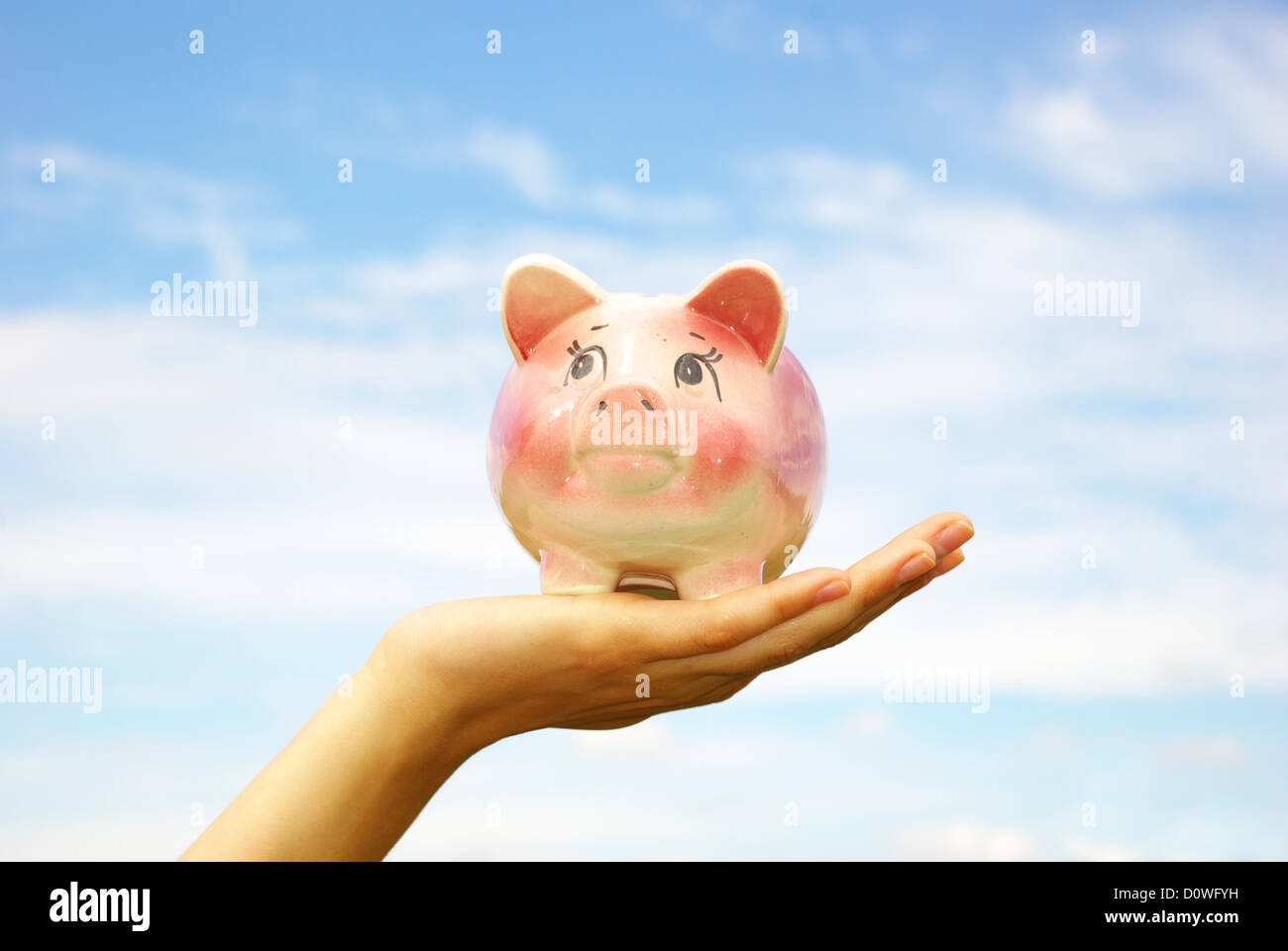 saving money woman hands holding piggy bank Stock Photo - Alamy