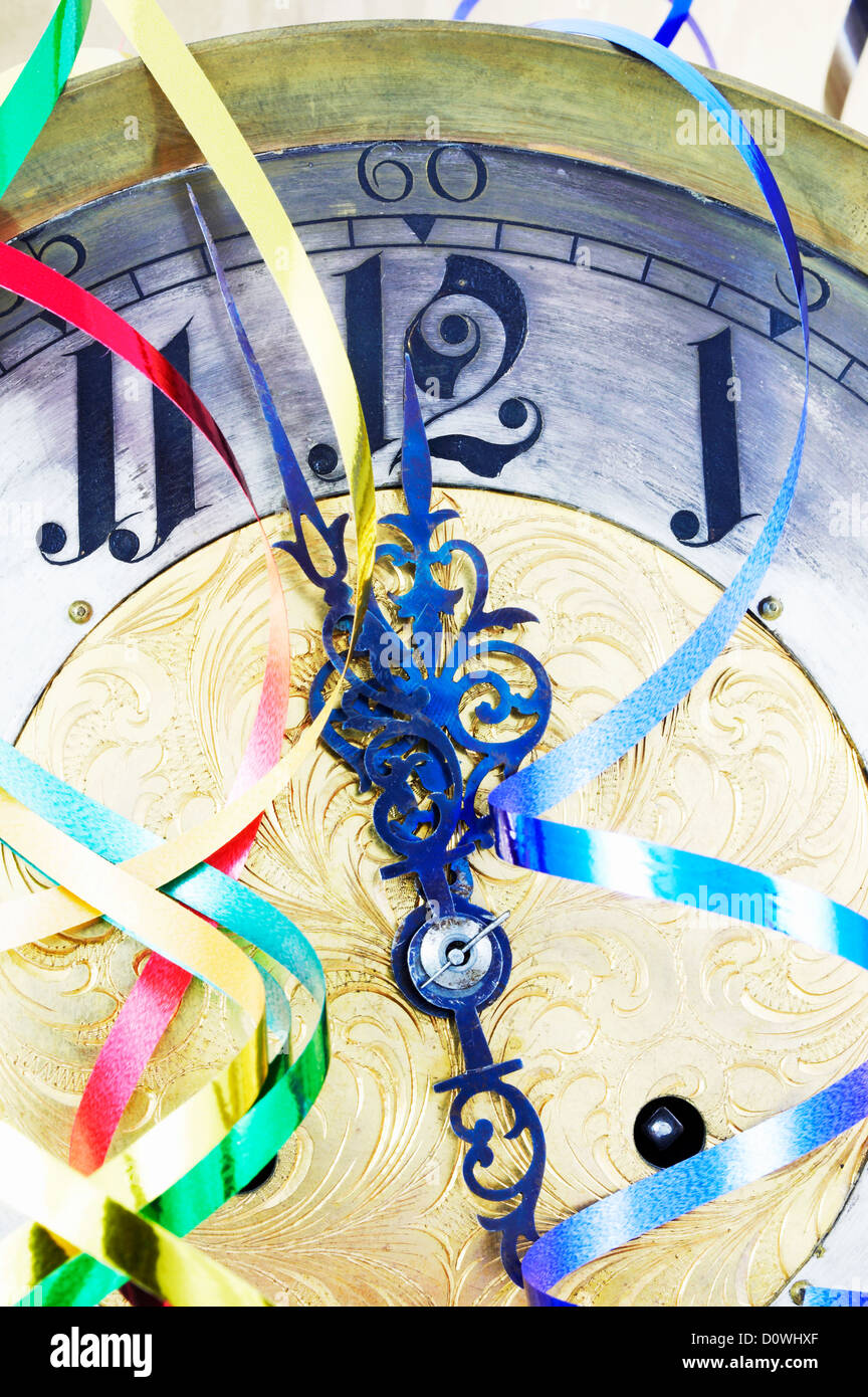 Antique clock with New Year ribbons Stock Photo - Alamy