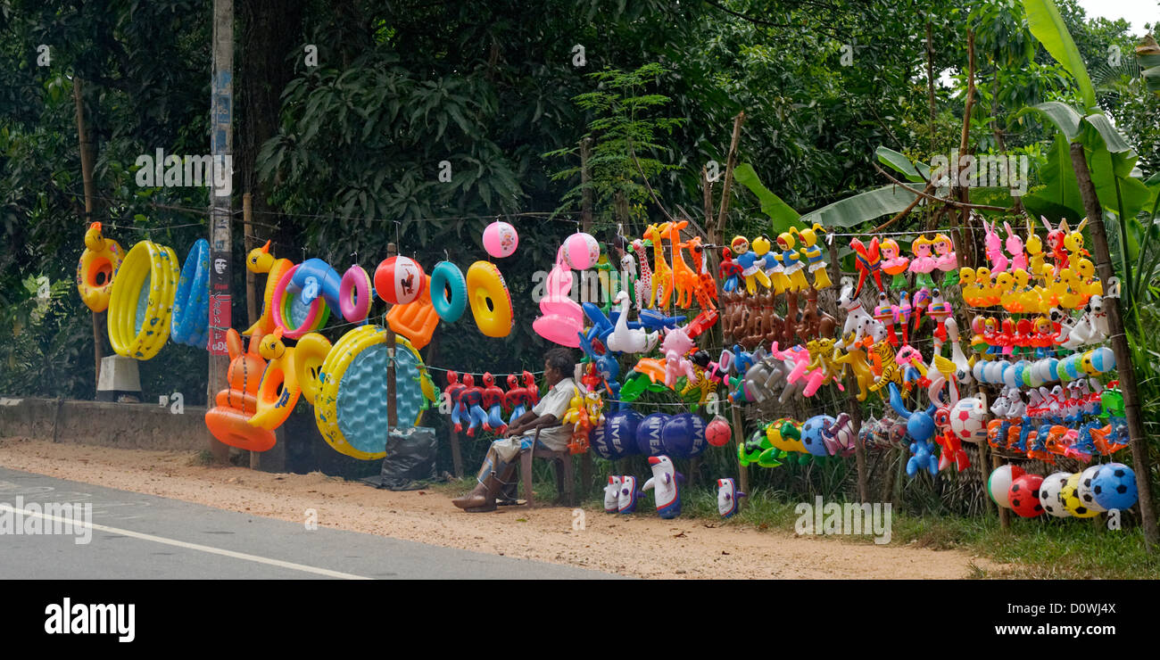 Inflatable toys nd beach goods sold by the road, Kandy, Sri Lanka. Stock Photo