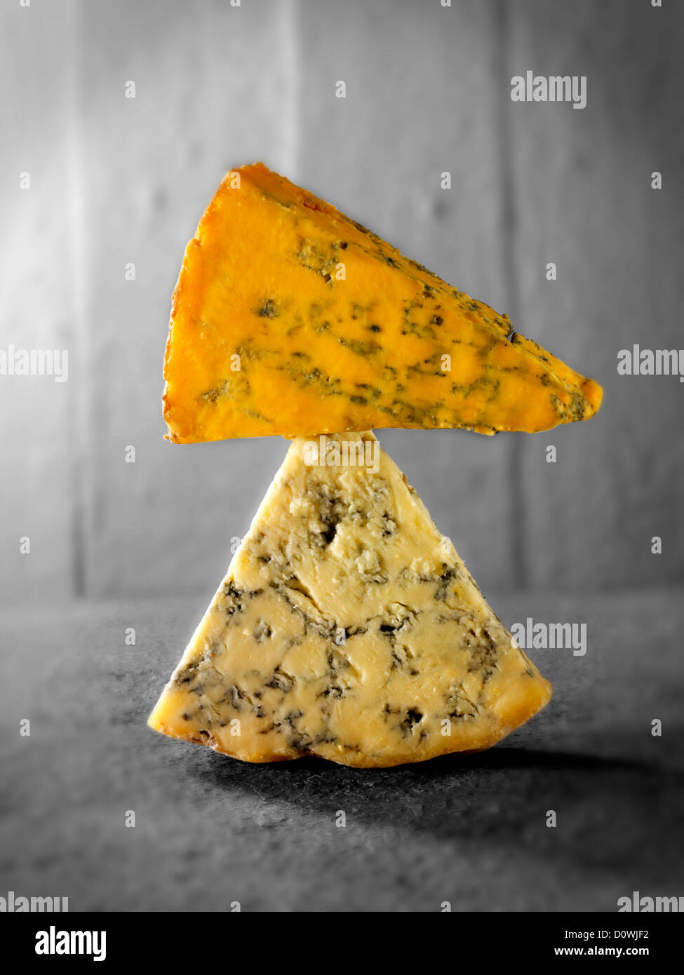 English blue cheese wedges - stilton, white stilton and blacksticks Stock Photo