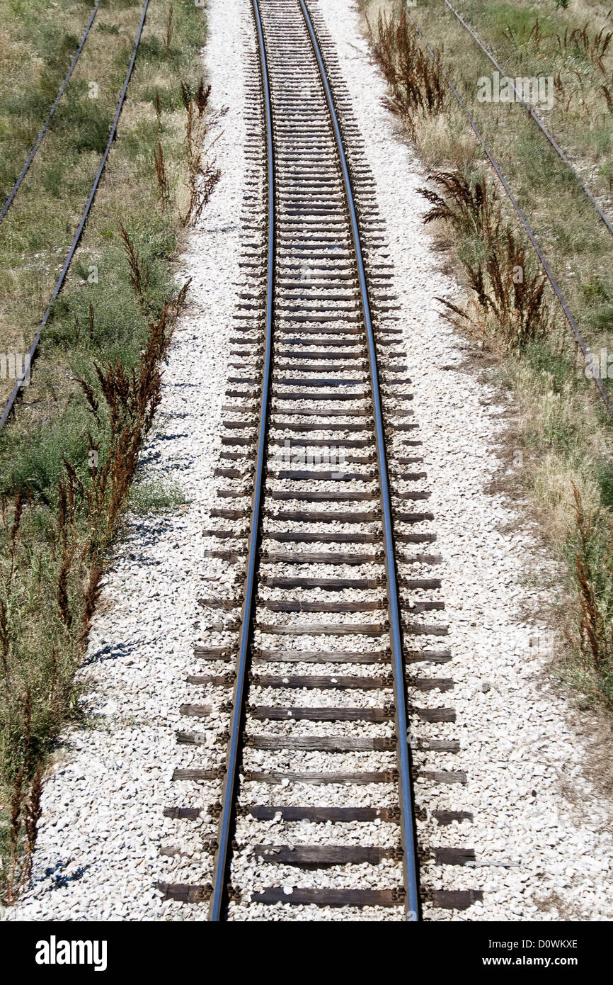 Railroad track through the landscape Stock Photo