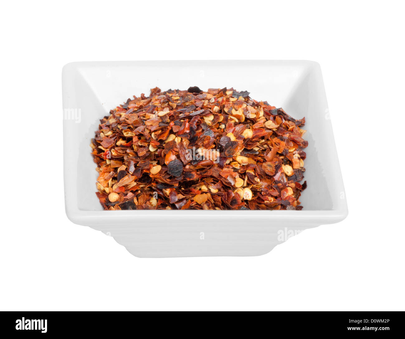 Coarsely ground red pepper.White isolated Stock Photo
