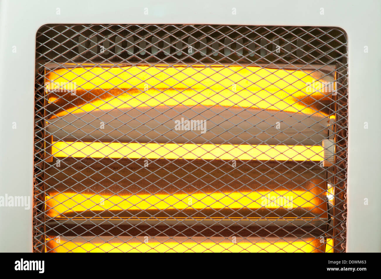 Electric heater with halogen coils close up. Luminous halogen coils background Stock Photo