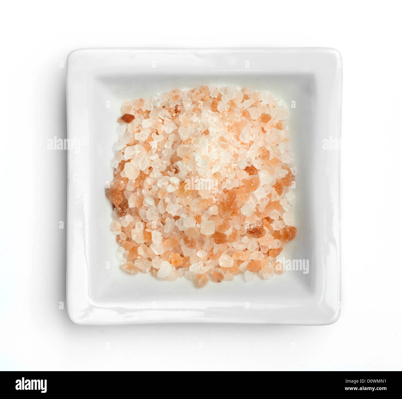 Natural coarse salt in a bowl white isolated Stock Photo Alamy