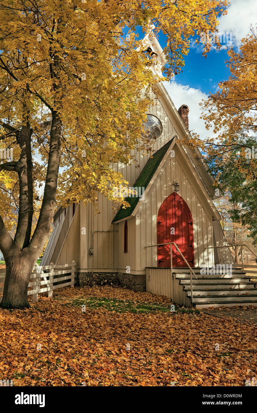 Autumn color frames The Ascension Chapel (1876 )in the rural town of Cove and NE Oregon’s Union County. Stock Photo