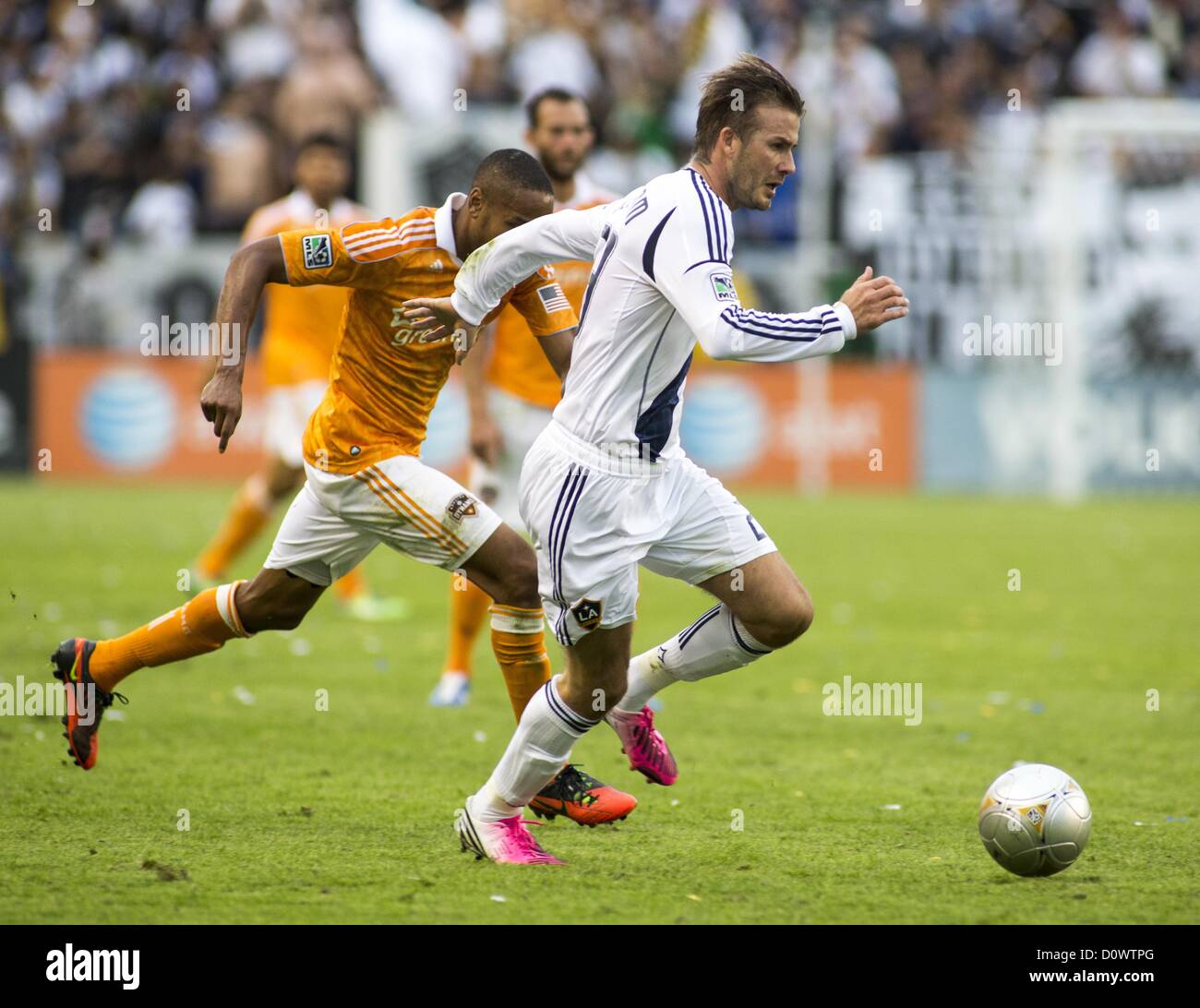 Dec. 1, 2012 - Los Angeles, California (CA, United States - Los Angeles Galaxy star David Beckham #23 chases a ball against Houston Dynamo's Ricardo Clark #13 during his farewell game in the Major League Soccer (MLS) Cup final at the Home Depot Center on December 1, 2012 in Carson, California. The Galaxy defeated Houston Dynamo 3-1 to win the MLS Cup Championship. Beckham will be leaving the team after the game. He joined the L.A. Galaxy back on January 11, 2007, when he signed a 5-year contract worth $32.5ÃŠmillion. He has played in over 98 games during his six season stint with the Galaxy an Stock Photo