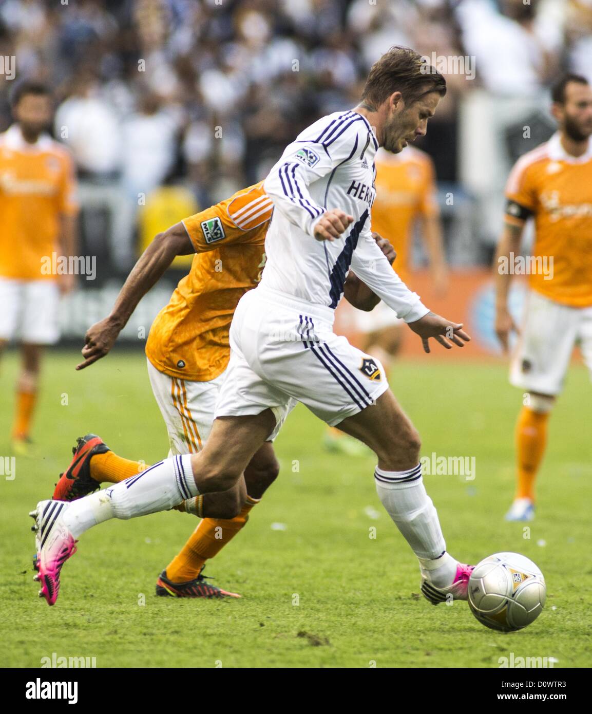 Dec. 1, 2012 - Los Angeles, California (CA, United States - Los Angeles Galaxy star David Beckham #23 battles for a ball against Houston Dynamo's Ricardo Clark #13 during his farewell game in the Major League Soccer (MLS) Cup final at the Home Depot Center on December 1, 2012 in Carson, California. The Galaxy defeated Houston Dynamo 3-1 to win the MLS Cup Championship. Beckham will be leaving the team after the game. He joined the L.A. Galaxy back on January 11, 2007, when he signed a 5-year contract worth $32.5ÃŠmillion. He has played in over 98 games during his six season stint with the Gala Stock Photo