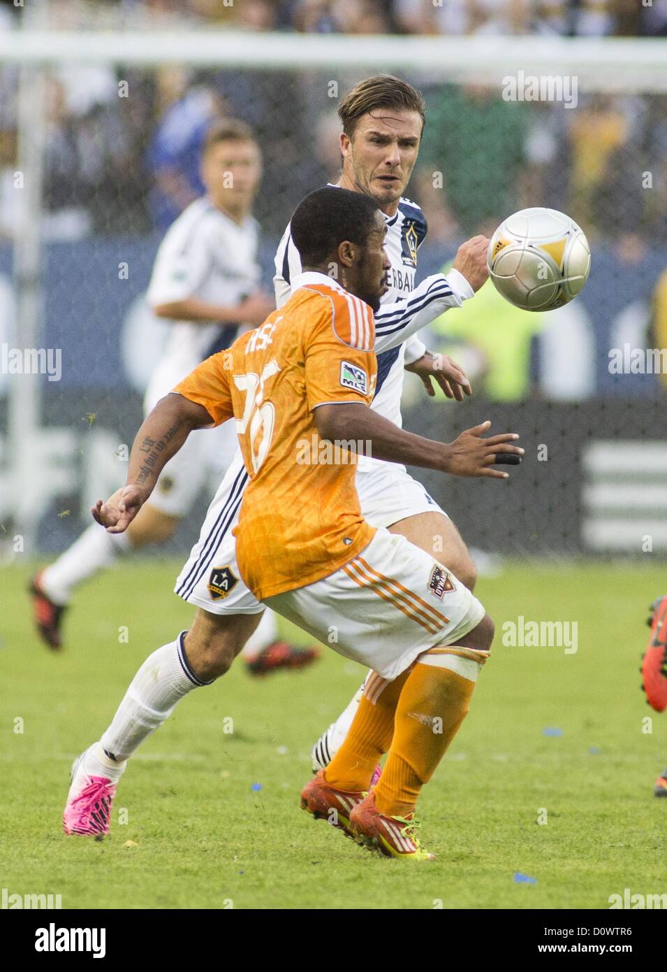 Dec. 1, 2012 - Los Angeles, California (CA, United States - Los Angeles Galaxy star David Beckham #23 battles a ball against Houston Dynamo's Corey Ashe #26 during his farewell game in the Major League Soccer (MLS) Cup final at the Home Depot Center on December 1, 2012 in Carson, California. The Galaxy defeated Houston Dynamo 3-1 to win the MLS Cup Championship. Beckham will be leaving the team after the game. He joined the L.A. Galaxy back on January 11, 2007, when he signed a 5-year contract worth $32.5ÃŠmillion. He has played in over 98 games during his six season stint with the Galaxy and  Stock Photo