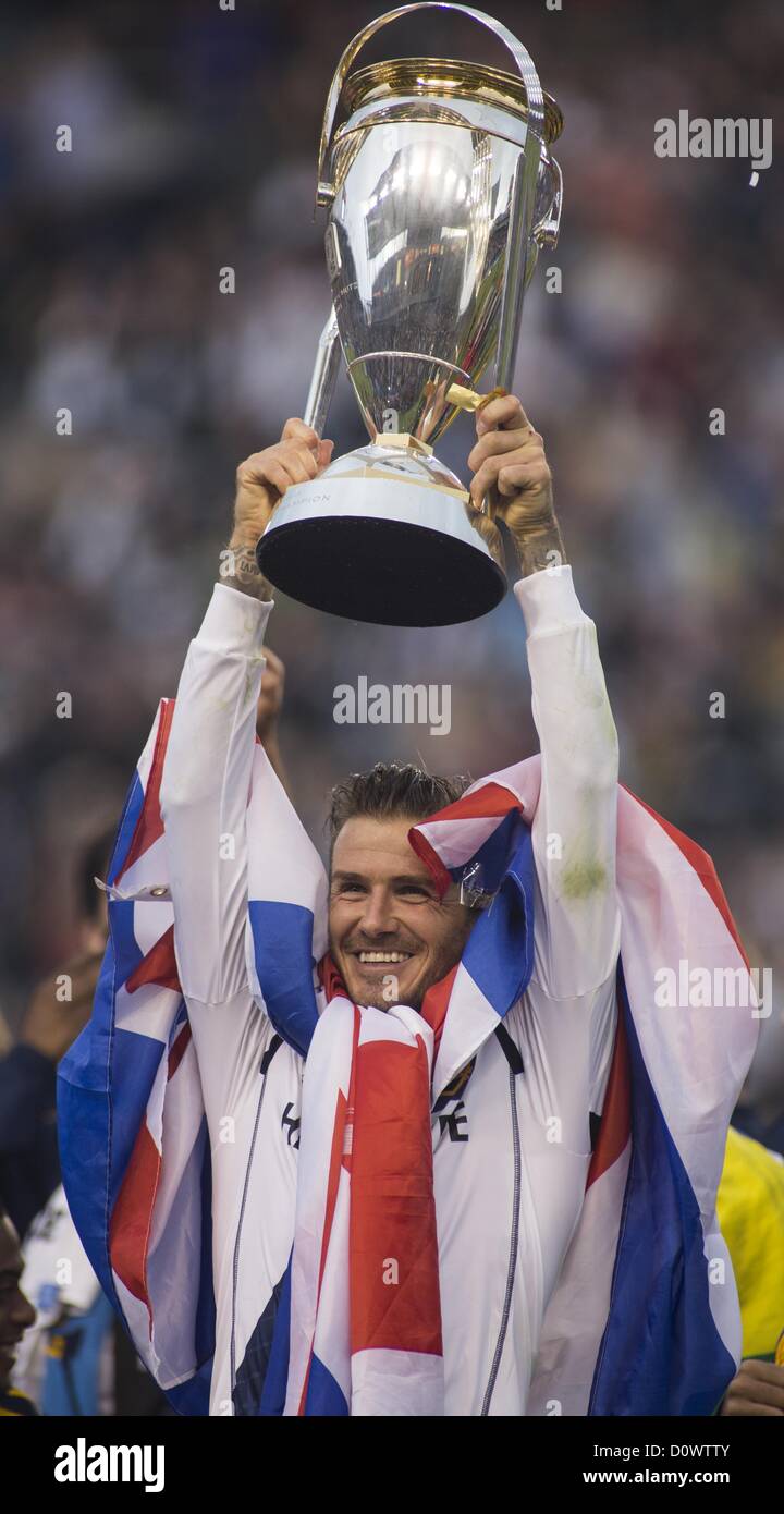 Dec. 1, 2012 - Los Angeles, California (CA, United States - Los Angeles Galaxy star David Beckham #23 rises up the trophy as he celebrates with his teammates after the Galaxy defeat the Houston Dynamo 3-1 to win the 2012 Major League Soccer (MLS) Cup final at the Home Depot Center on December 1, 2012 in Carson, California. Beckham will be leaving the team after the game. He joined the L.A. Galaxy back on January 11, 2007, when he signed a 5-year contract worth $32.5ÃŠmillion. He has played in over 98 games during his six season stint with the Galaxy and just last season was named an MLS all-st Stock Photo