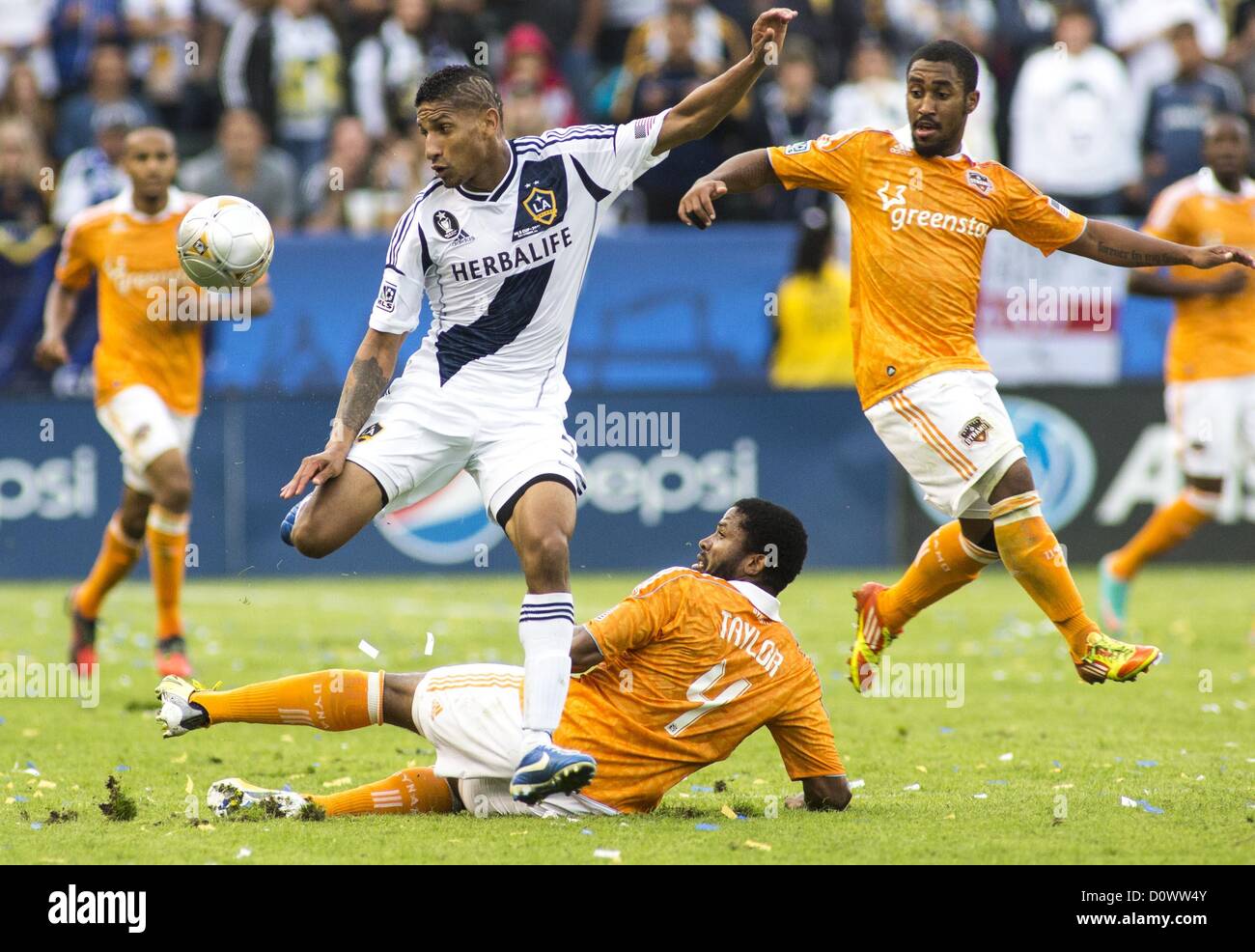 Dec. 1, 2012 - Los Angeles, California (CA, United States - Los Angeles Galaxy Sean Franklin #5 drives the ball over Houston Dynamo's Jermaine Taylor #4 during the Major League Soccer (MLS) Cup final at the Home Depot Center on December 1, 2012 in Carson, California. The Galaxy defeated Houston Dynamo 3-1 to win the MLS Cup Championship. (Credit Image: © Ringo Chiu/ZUMAPRESS.com) Stock Photo