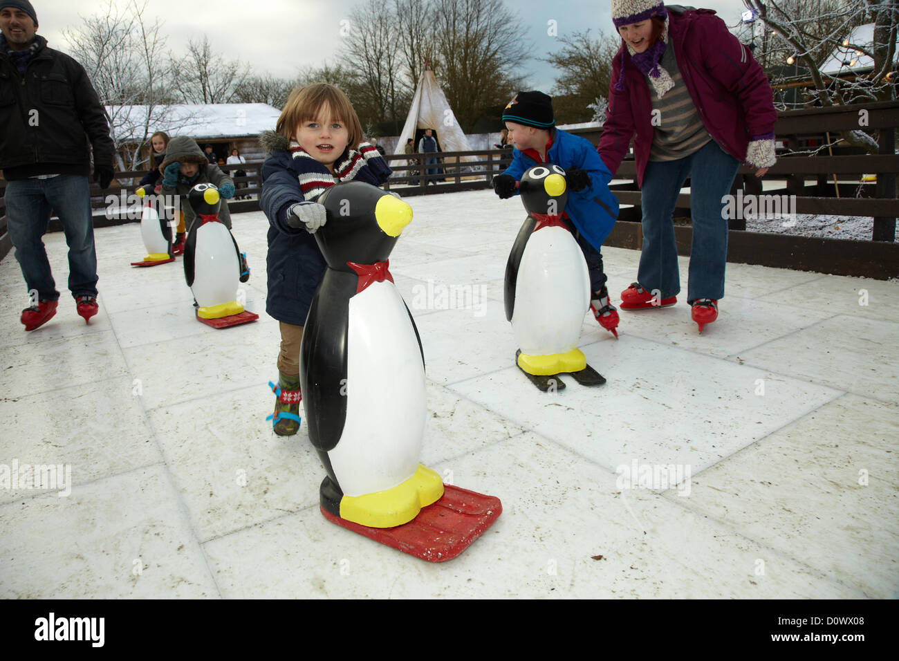 Skating on the outdoor ice rink, in the Elf village. Lapland UK, Bewl Water, Kent, December 1