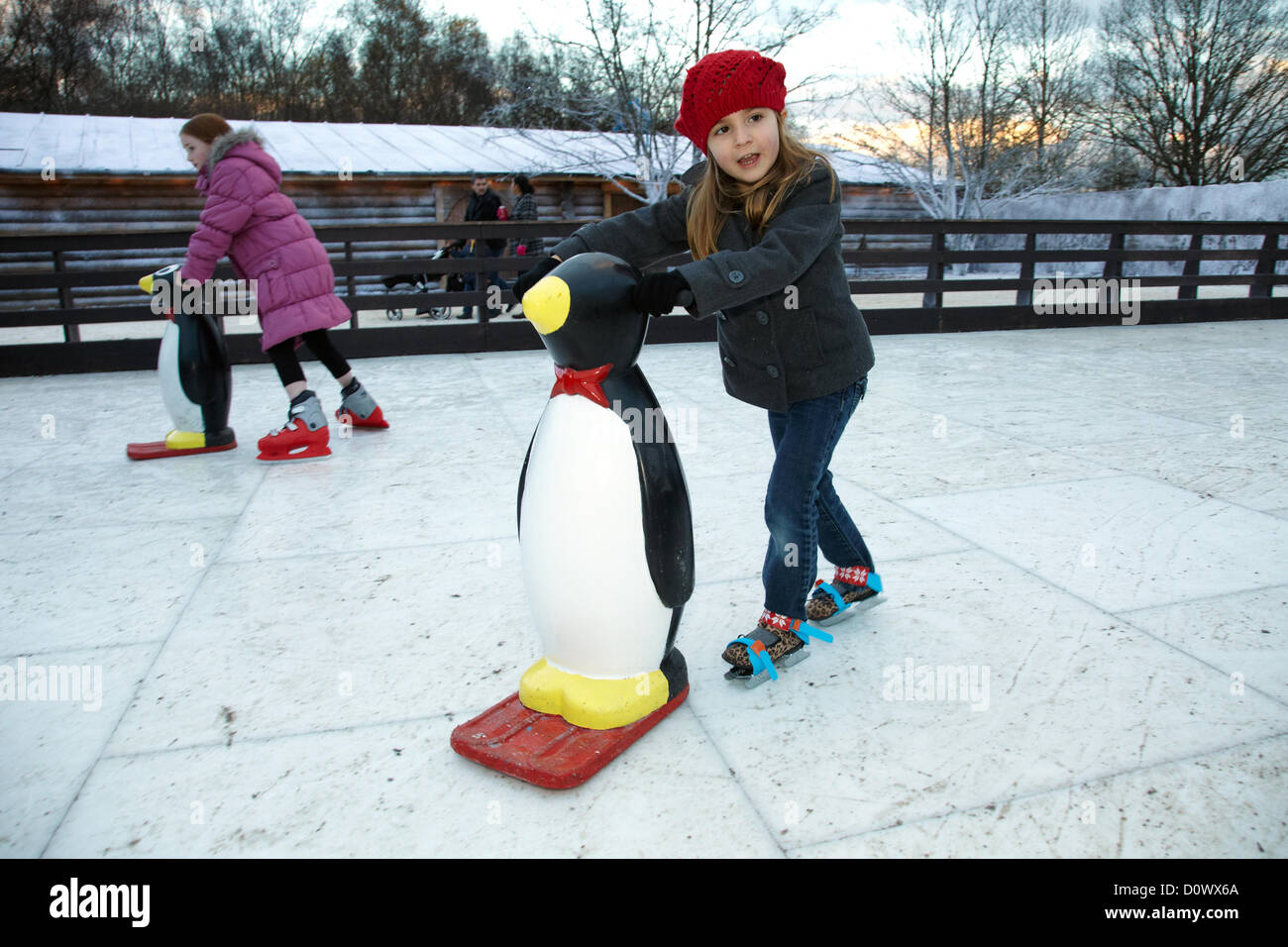 Skating on the outdoor ice rink, in the Elf village. Lapland UK, Bewl Water, Kent, December 1