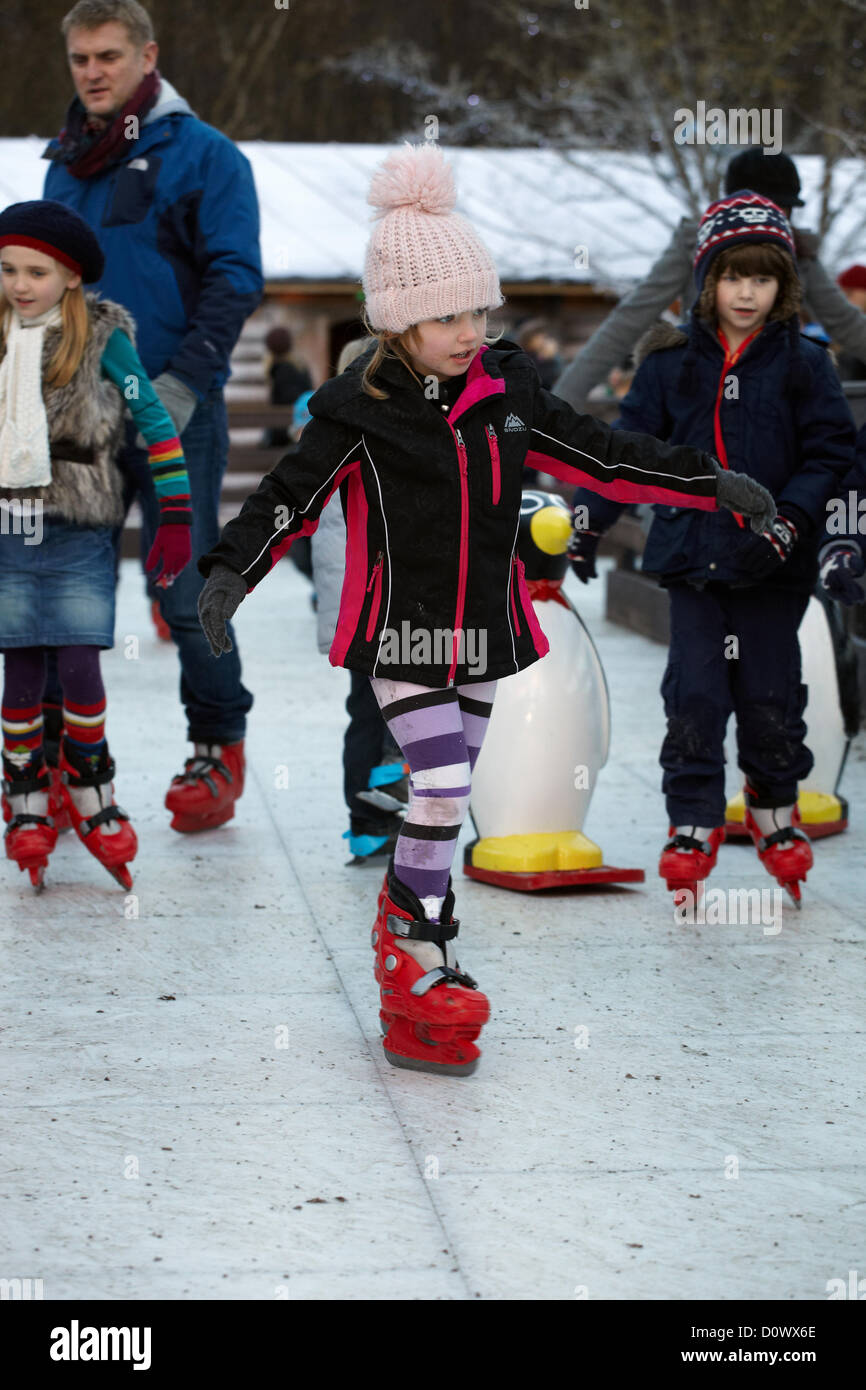 Skating on the outdoor ice rink, in the Elf village. Lapland UK, Bewl Water, Kent, December 1