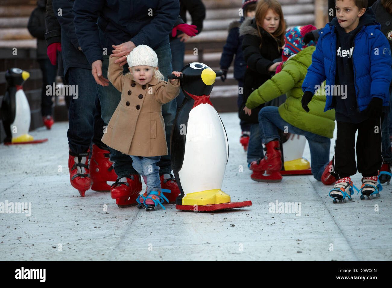 Skating on the outdoor ice rink, in the Elf village. Lapland UK, Bewl Water, Kent, December 1