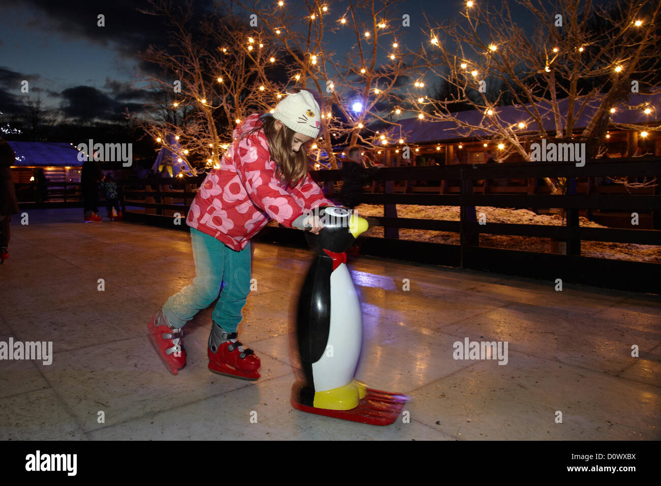 Skating on the outdoor ice rink, in the Elf village. Lapland UK, Bewl Water, Kent, December 1