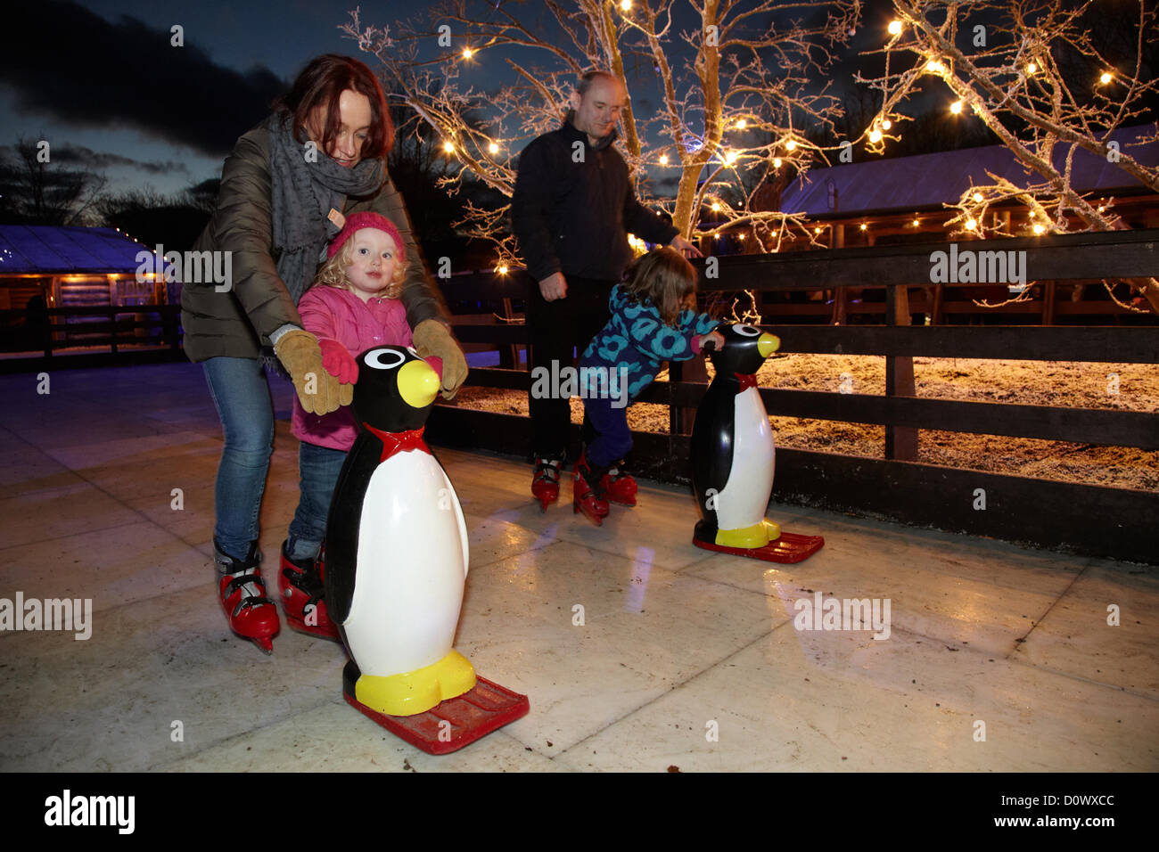 Skating on the outdoor ice rink, in the Elf village. Lapland UK, Bewl Water, Kent, December 1