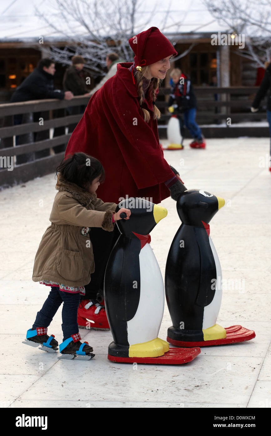 Skating on the outdoor ice rink, in the Elf village. Lapland UK, Bewl Water, Kent, December 1