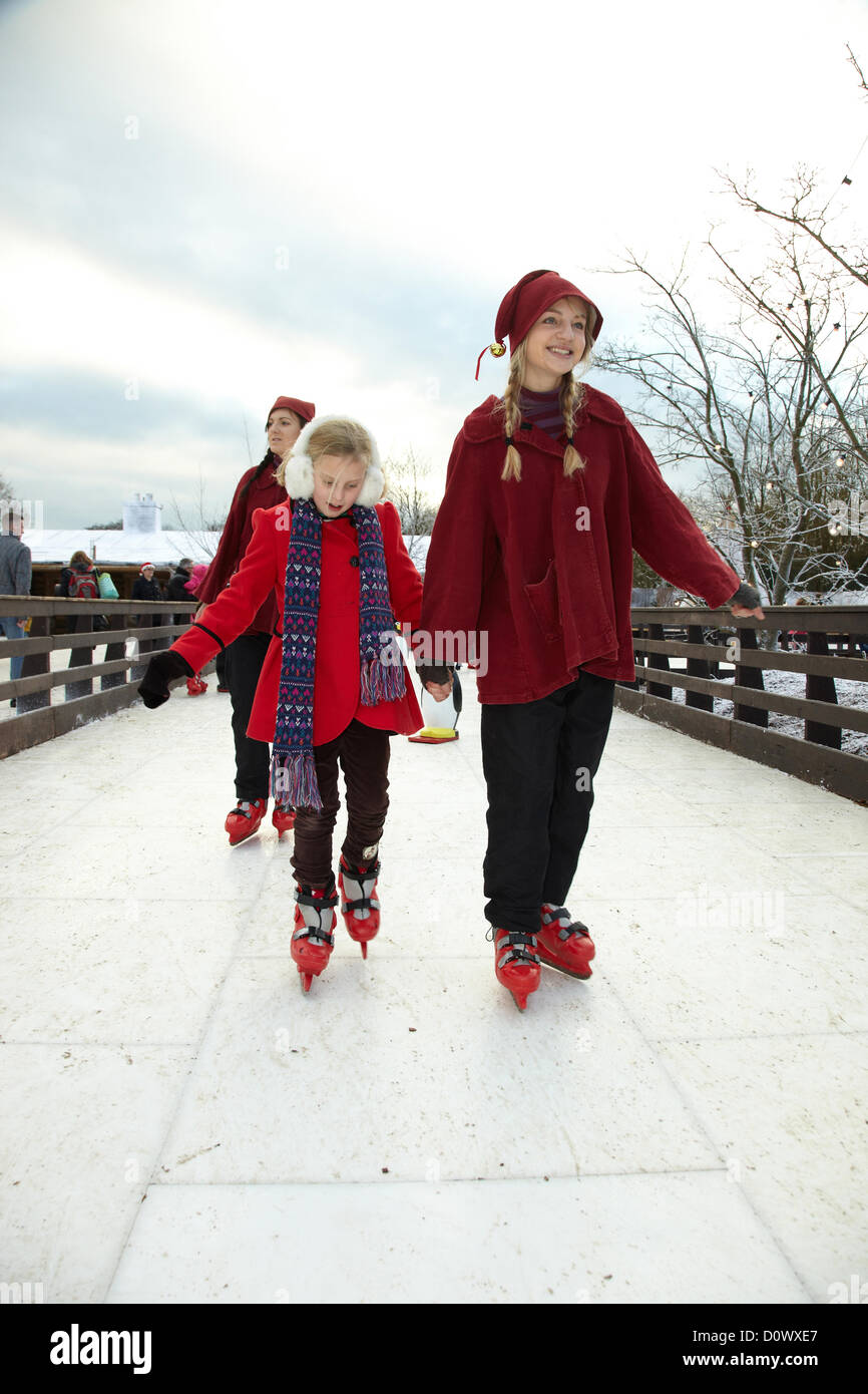 Skating on the outdoor ice rink, in the Elf village. Lapland UK, Bewl