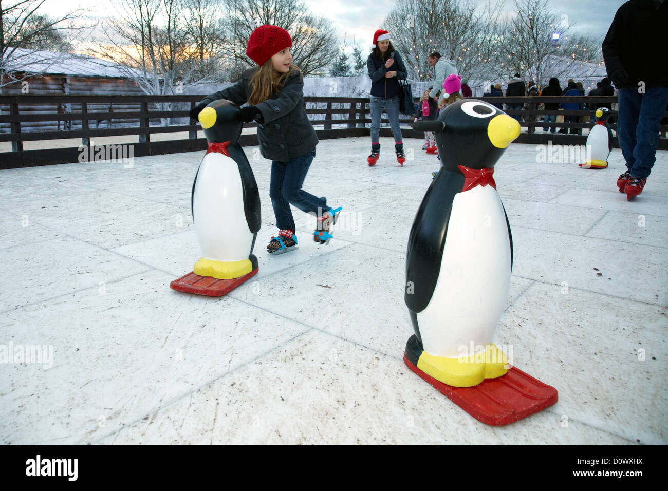 Skating on the outdoor ice rink, in the Elf village. Lapland UK, Bewl Water, Kent, December 1