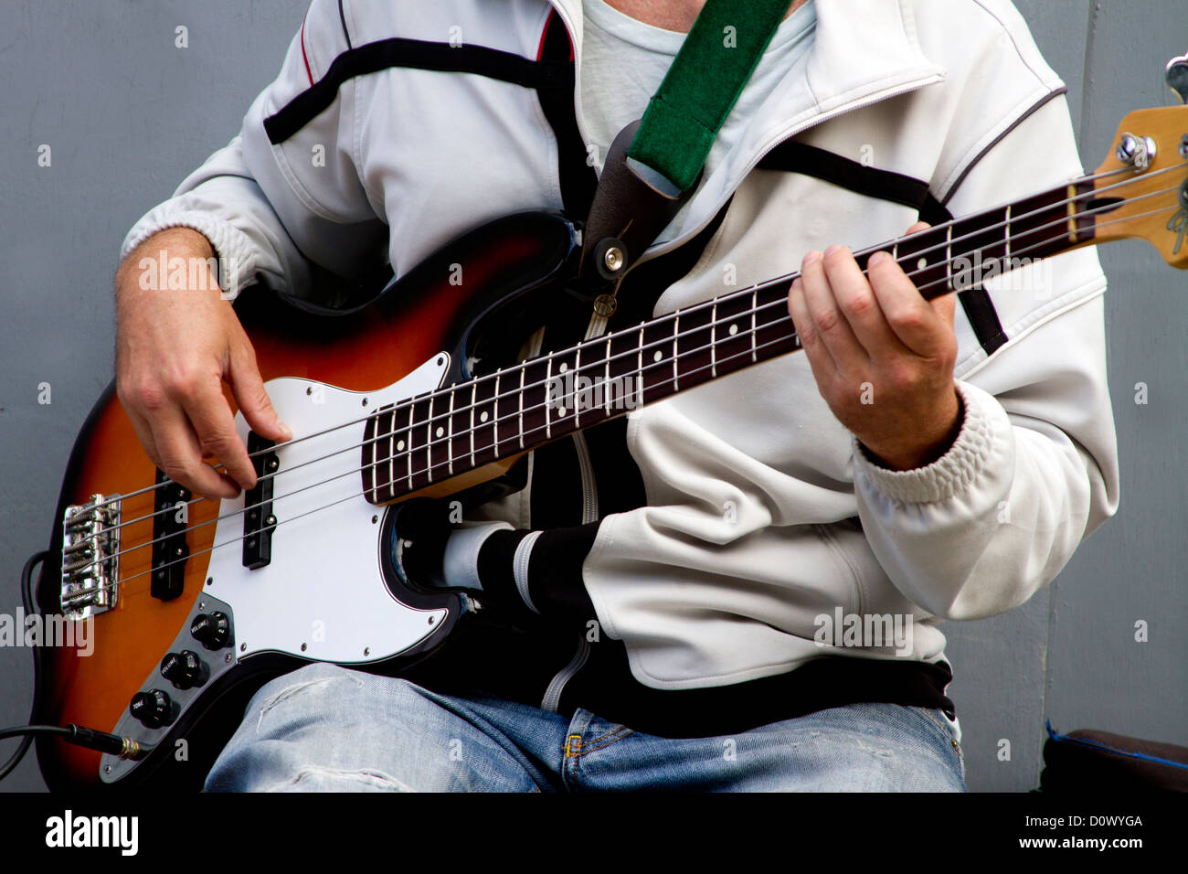 Bass Player playing on electric guitar with a band Stock Photo