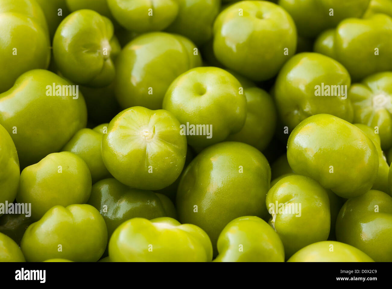 Closeup: Bright Green tomatillos. A basket of of bright green tomatillos shot from above. Stock Photo