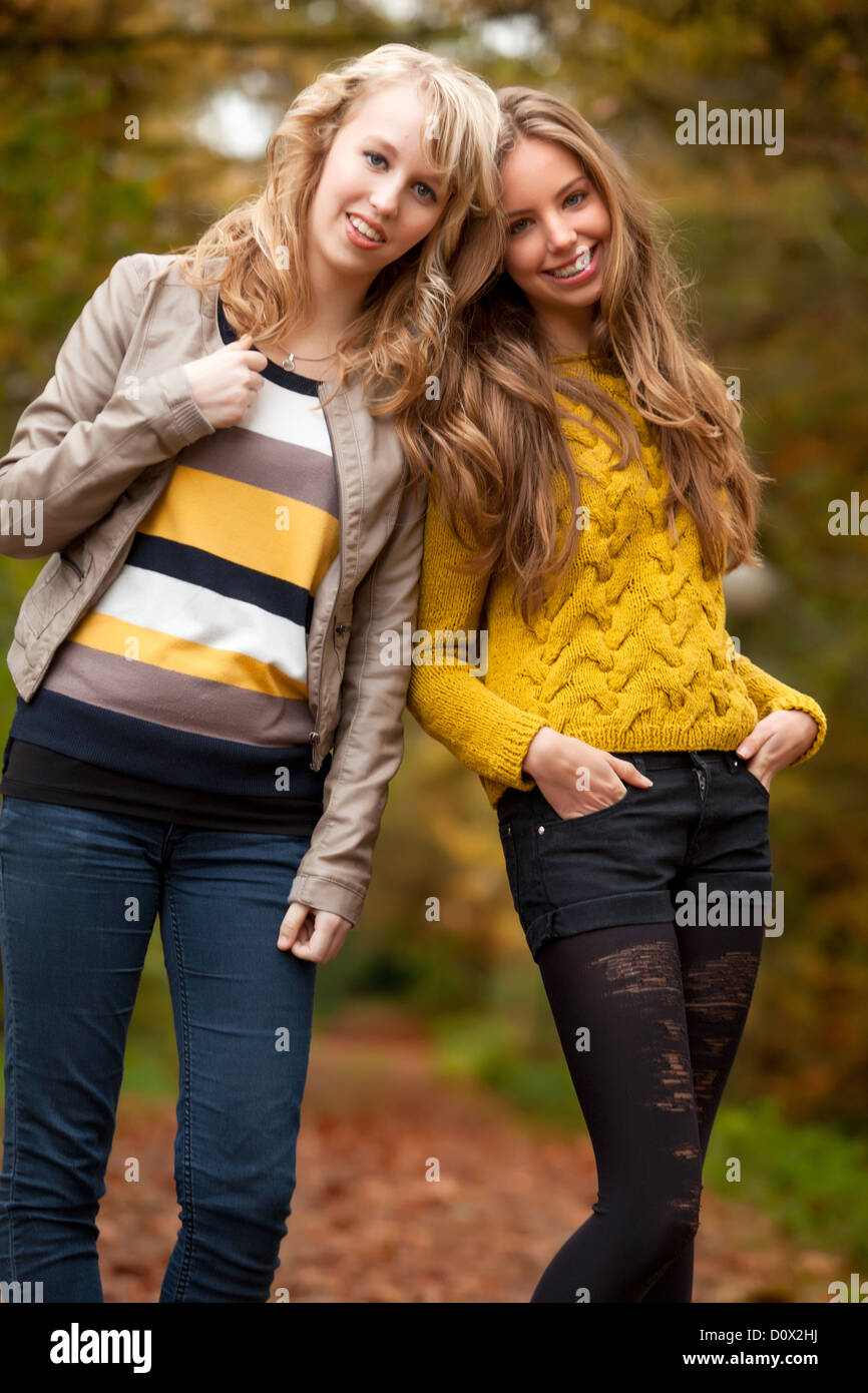 2 girls are having fun in the forest Stock Photo - Alamy