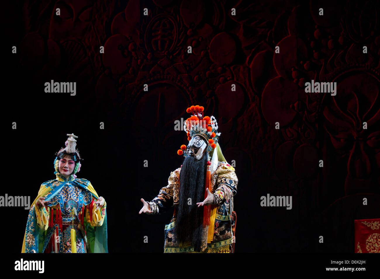 The leading actors in traditional costume pictured during a performance of Peking Opera at a theatre in Beijing, China Stock Photo