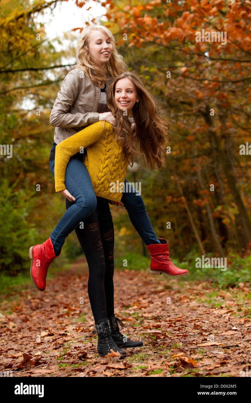 2 girls are having fun in the forest Stock Photo - Alamy