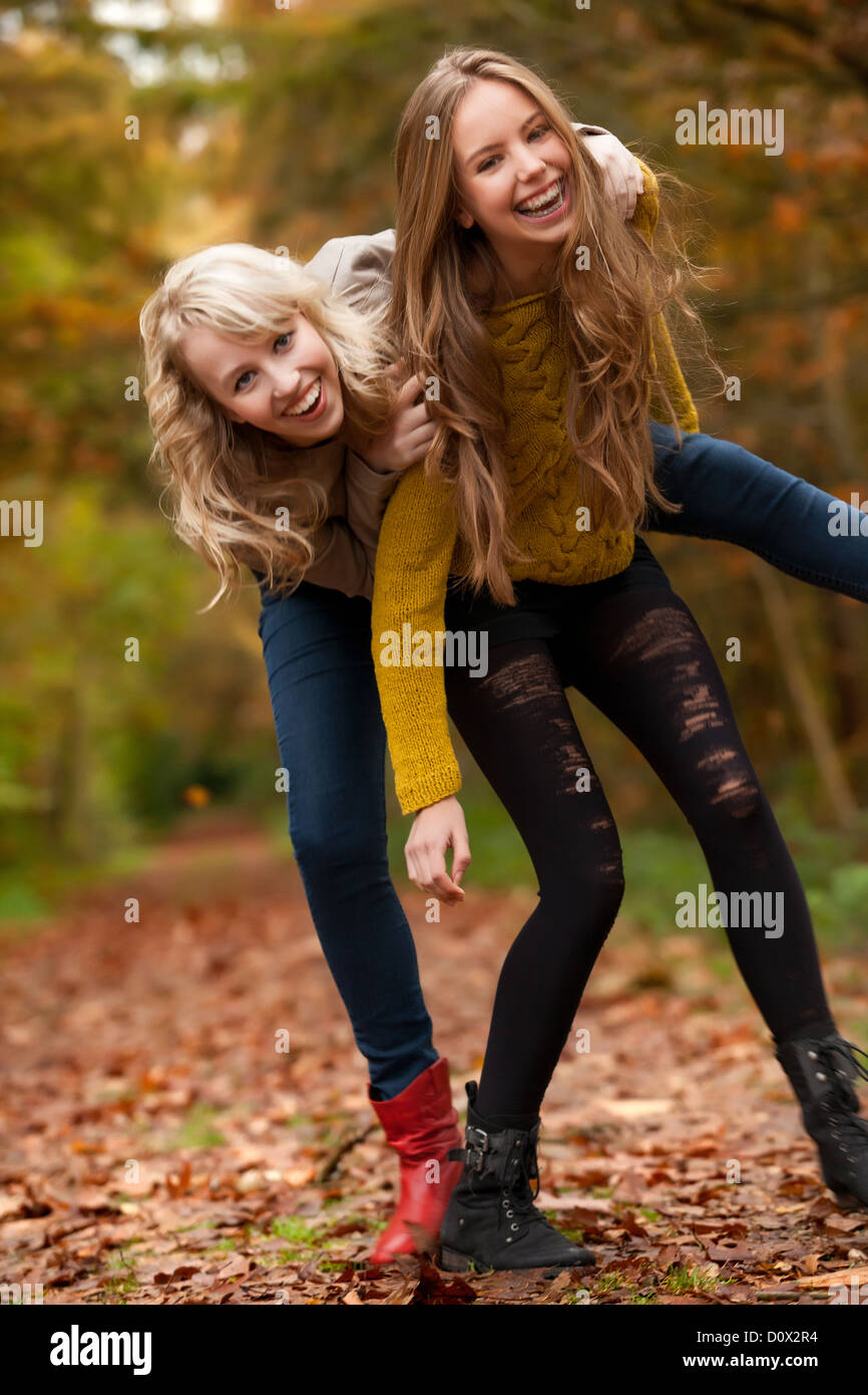 2 girls are having fun in the forest Stock Photo - Alamy