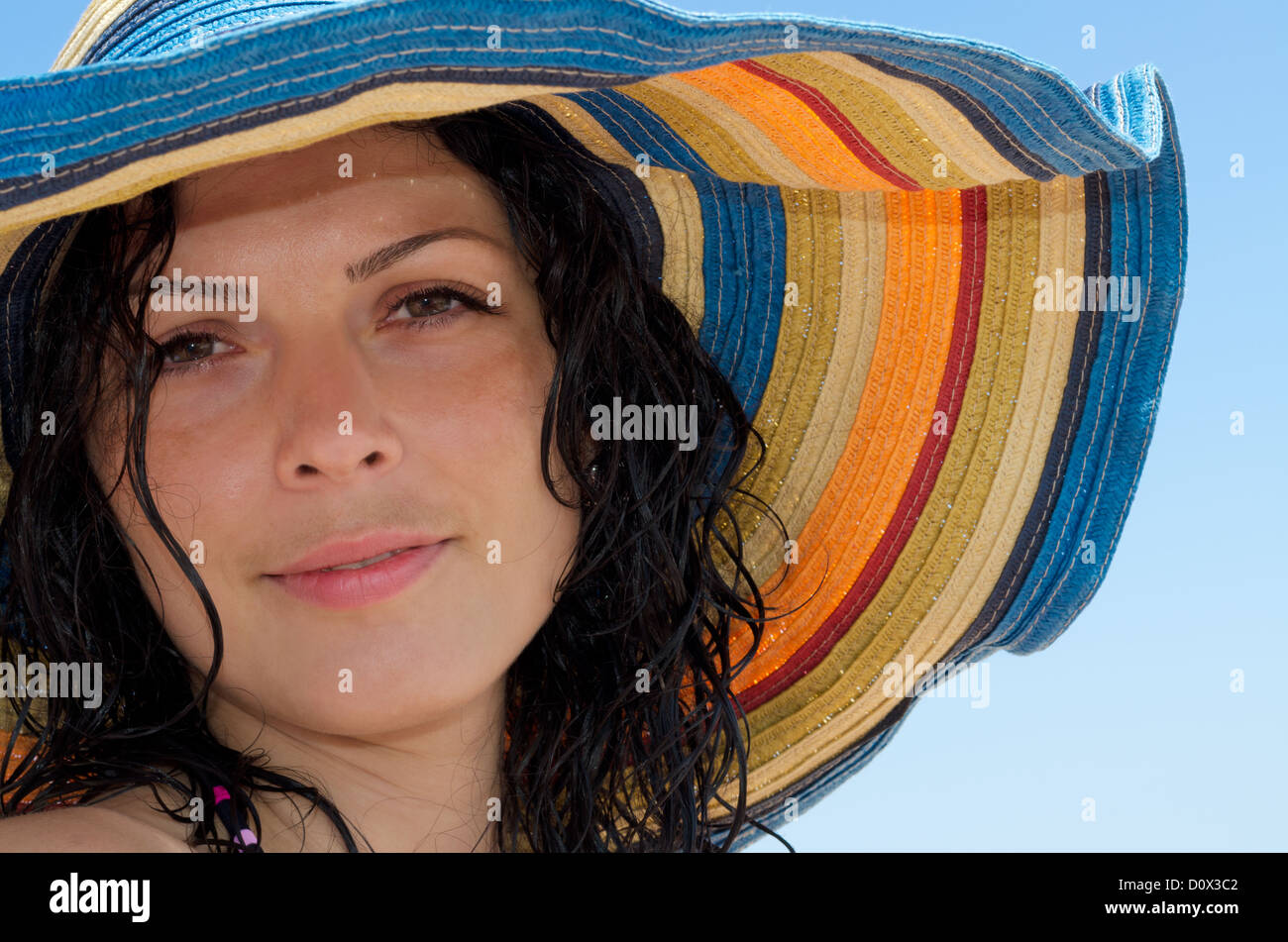 Close up portrait of attractive woman with colorful hat Stock Photo