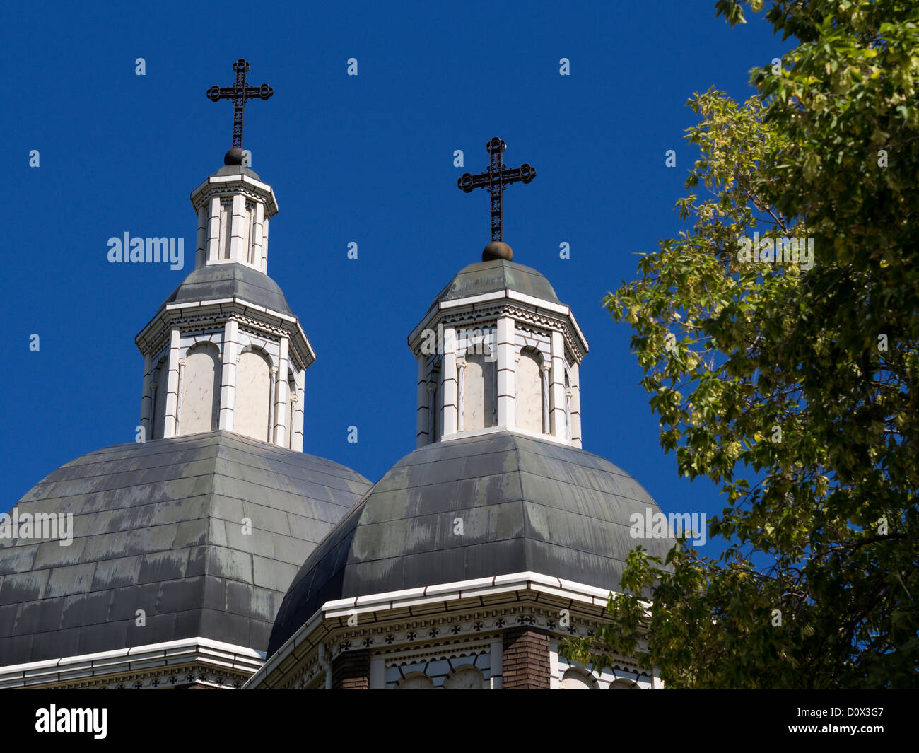 Two Domes with Crosses. Two domes topped with iron crosses atop the Ukrainian Catholic Cathedral in Edmonton. Stock Photo