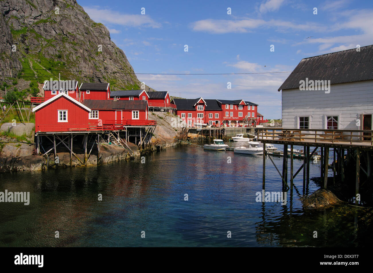 Small fishing village Å near Moskenes on the Lofoten Islands in Norway. Red houses and boats. Stock Photo