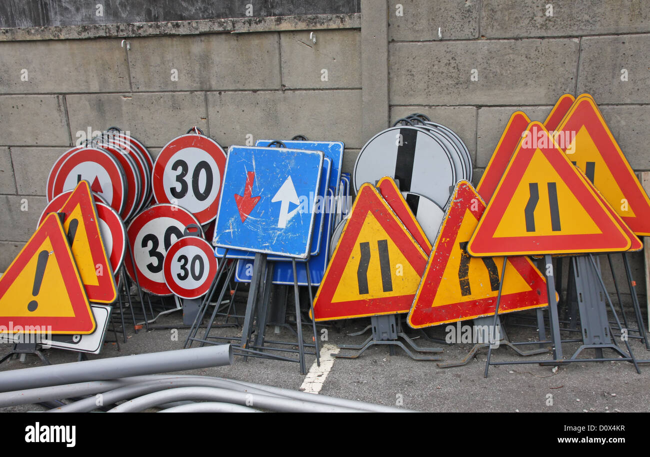 Group of billboards and road signs ready to be installed near the road works Stock Photo