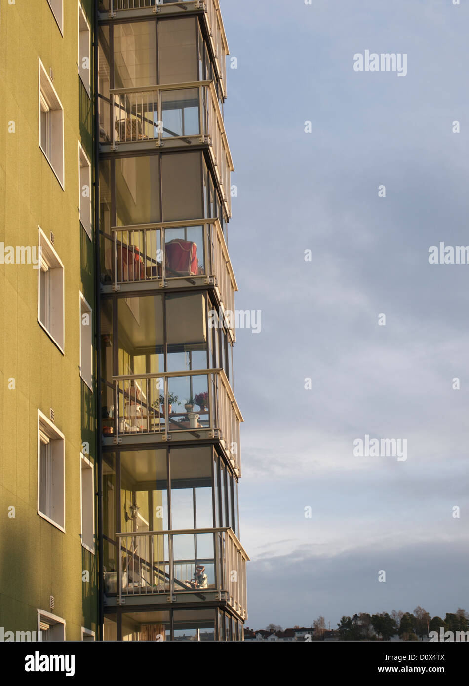 Glass balconies on olive coloured house, Oslo Norway Stock Photo