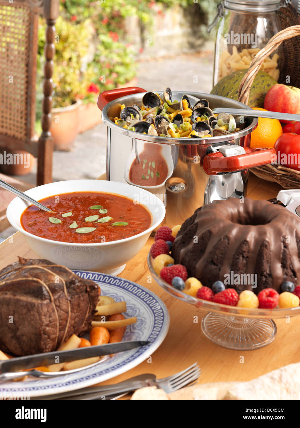 Pressure cooker beef pot roast tomato soup chocolate truffle ring cake clams macaroni Stock Photo