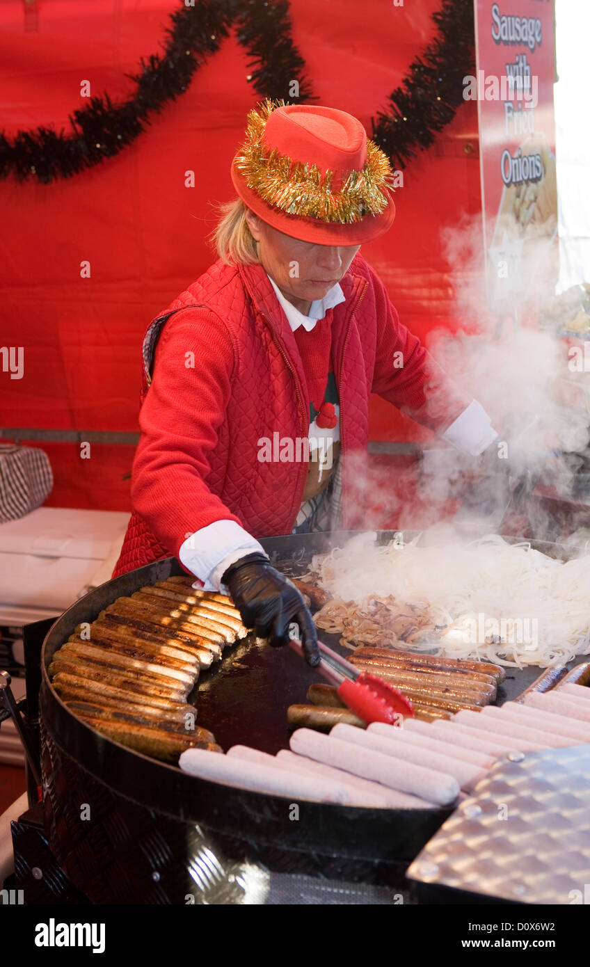 Cooking Sausages At A Mobile Food Stall Vans Skipton Christmas Market cooking-sausages-at-a-mobile-food-stall-vans-skipton-christmas-market