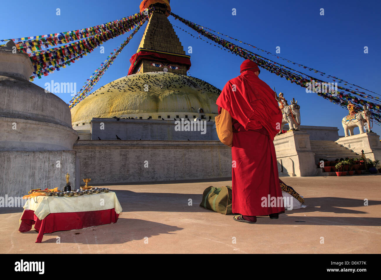 Buddhist monk at Boudhanath Stupa, Kathmandu, UNESCO World Heritage Site, Nepal Stock Photo
