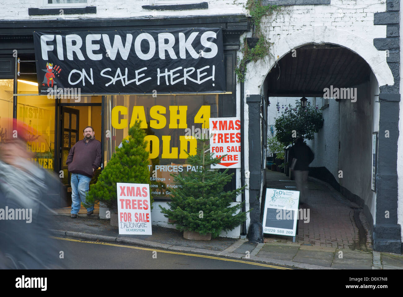 'Cash 4 Gold' shop selling fireworks and Christmas trees, Ulverston, Cumbria, England UK Stock Photo