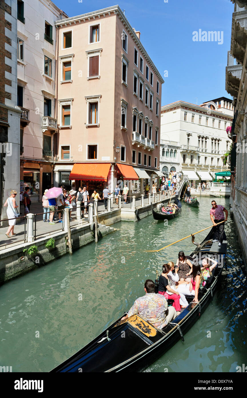 Tourists exploring Venice by gondolas, Venice, Italy. Stock Photo
