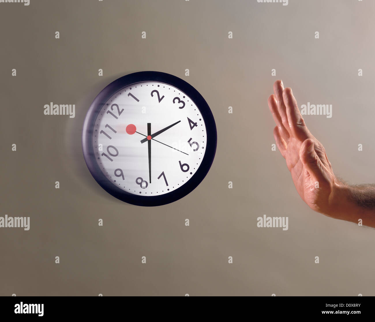 hand held up stopping clock in midair Stock Photo Alamy