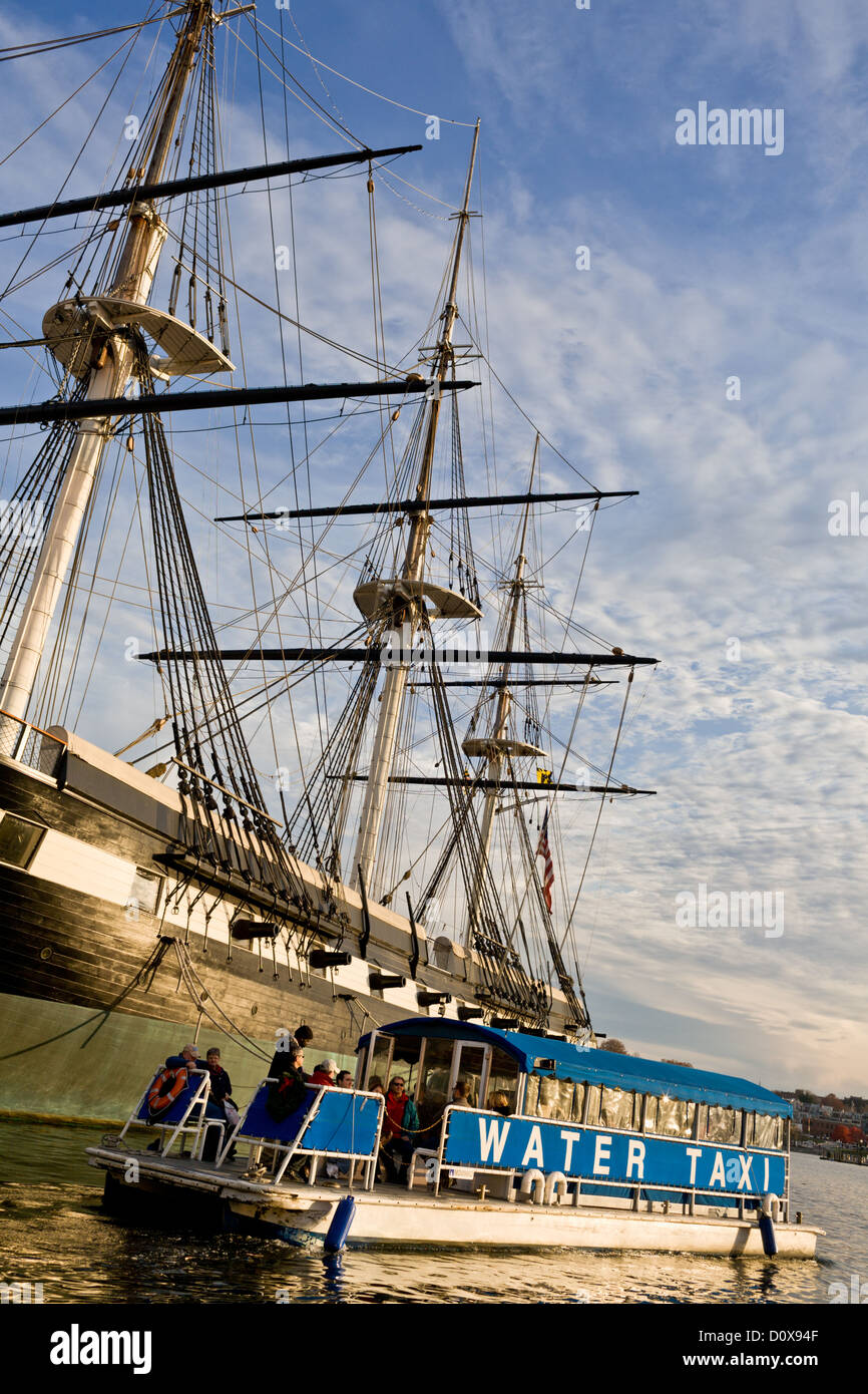 Water Taxi, Baltimore Harbor, USS Constellation behind. Stock Photo