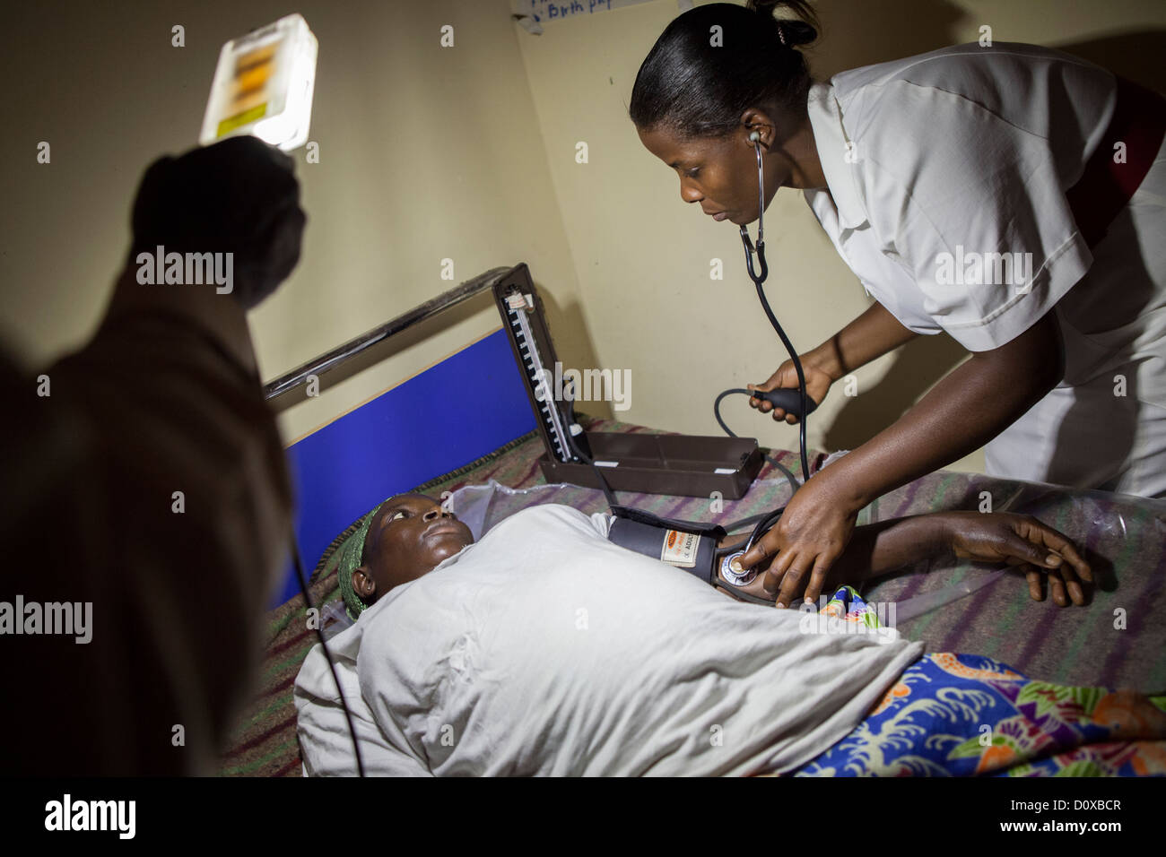 A pregnant woman is examined at a health centre on Bussi Island, Uganda, East Africa. Stock Photo