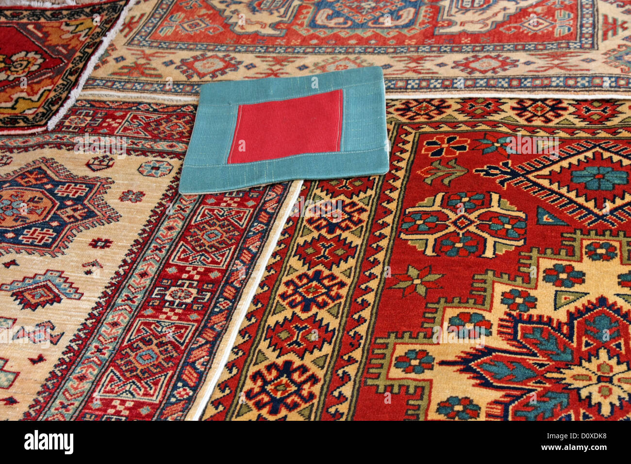 Blue carpet with red frame and other valuable oriental carpets on sale