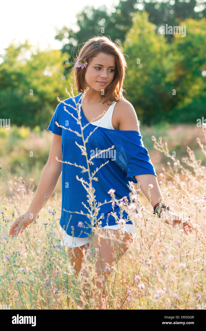 Beautiful young woman walking field hi-res stock photography and images ...