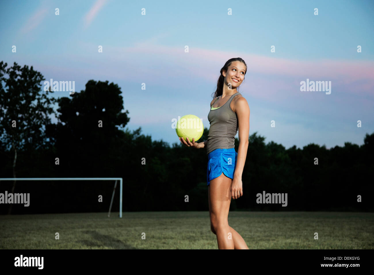 Girl holding soccer ball Stock Photo Alamy