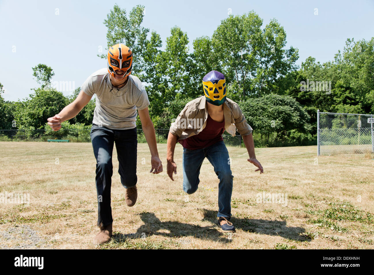 Two young men wearing wrestling masks Stock Photo Alamy