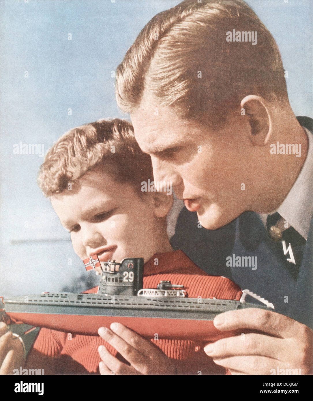 Boat, Swastika, German, father, son, toy, vessel, Nazi, flag, World War II, Germany, 1940, Stock Photo