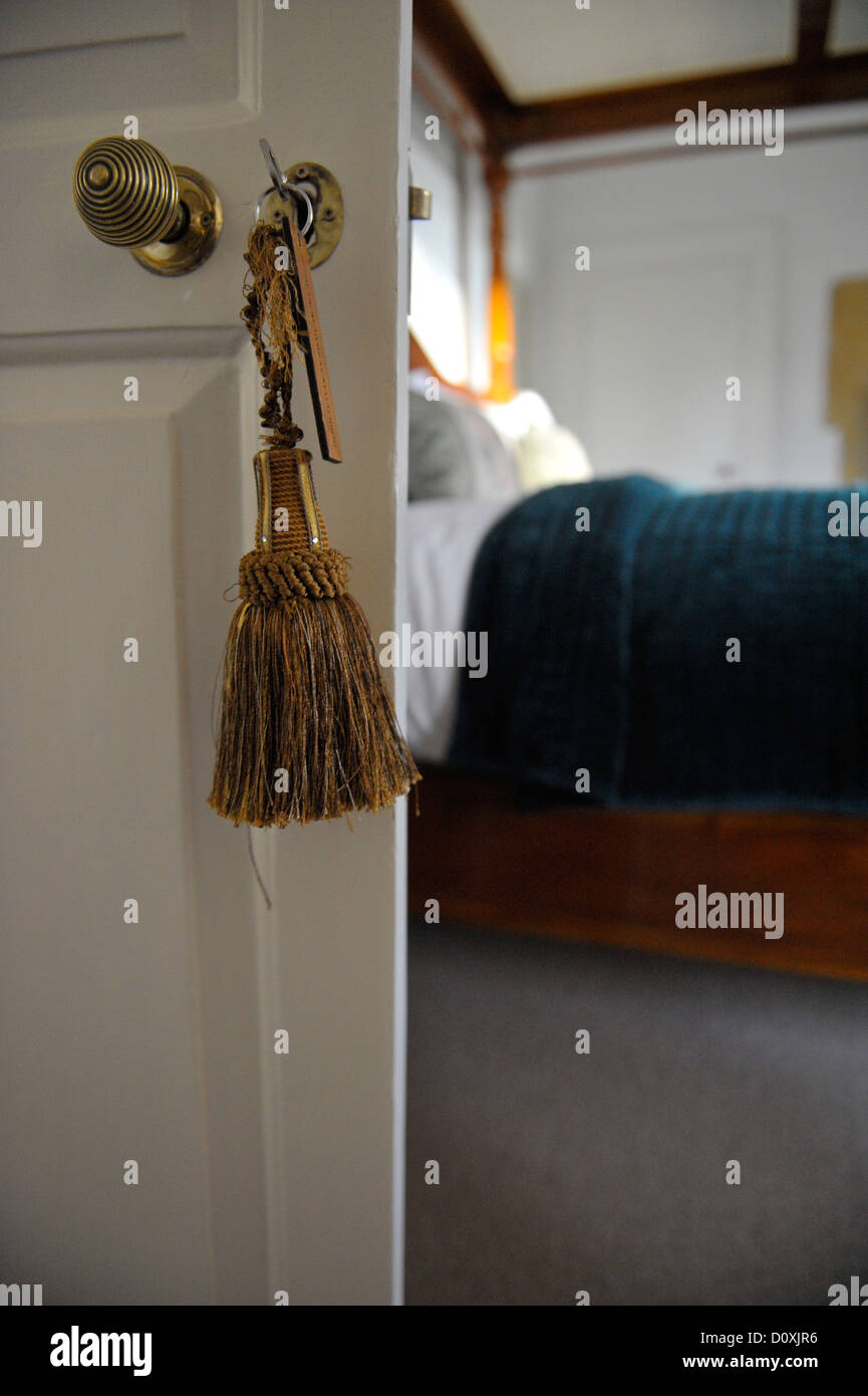 Key in bedroom door Stock Photo Alamy