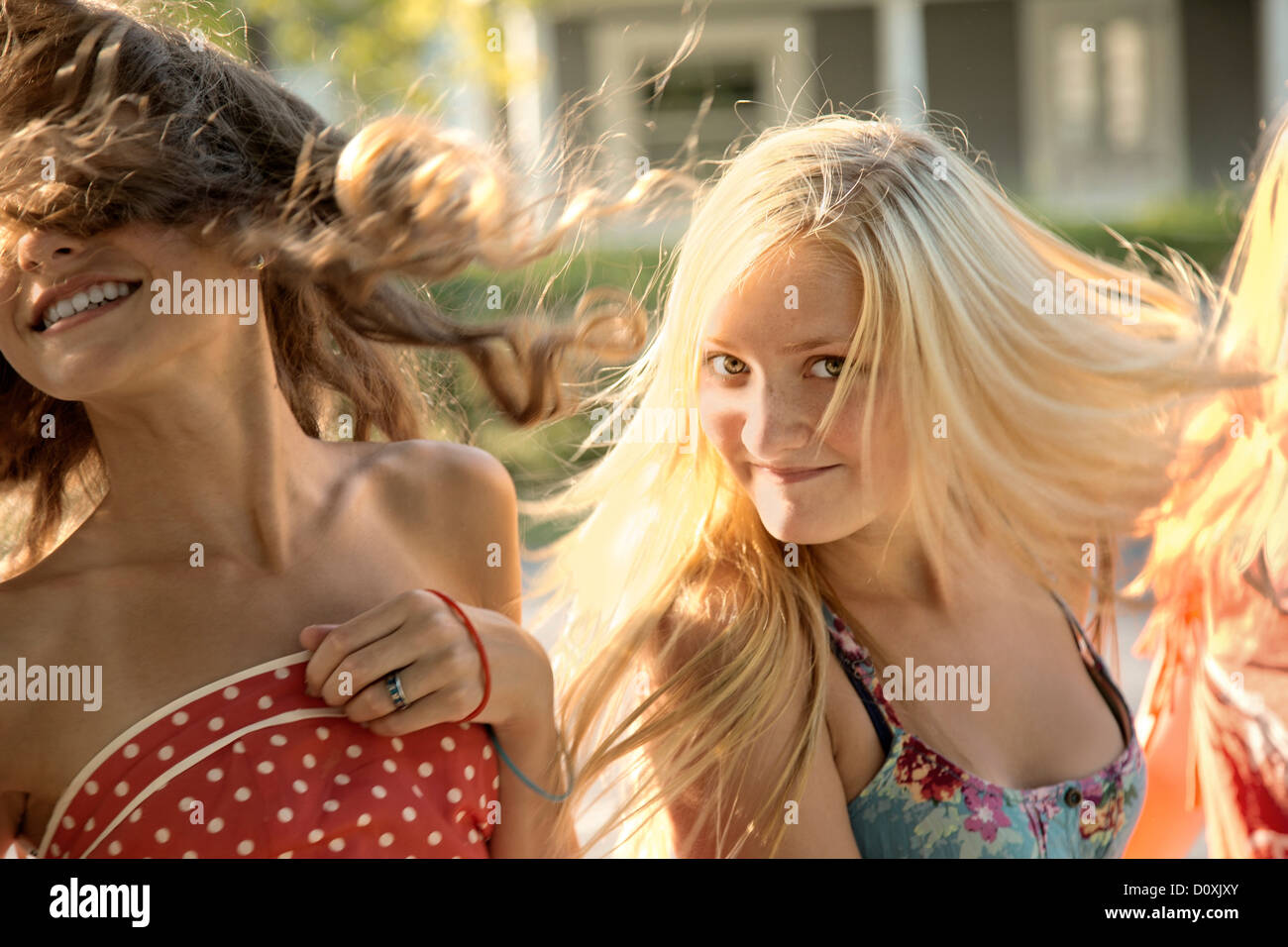 Girls with long hair in sunlight Stock Photo