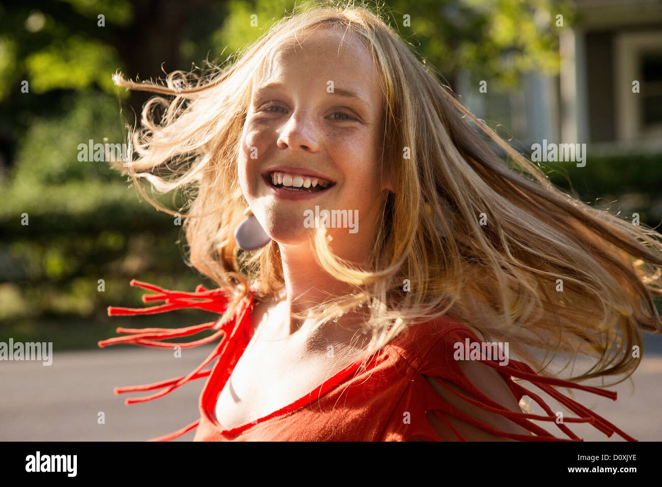 Close up portrait of blonde girl looking at camera smiling Stock Photo ...